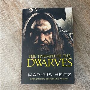 The Triumph of the Dwarves by Markus Heitz - Black Cover with Yellow Title